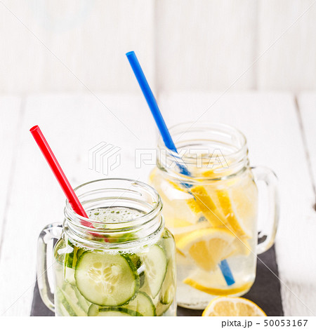 Two mugs of infused detox diet refreshing waters: with cucumber and lemon 50053167