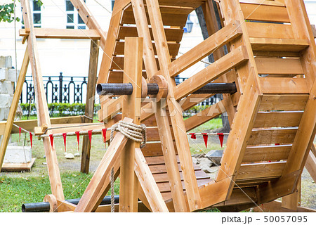 Ancient catapult close up. Defensive wall. Catapult in the downtown of the citywith the sea as 50057095