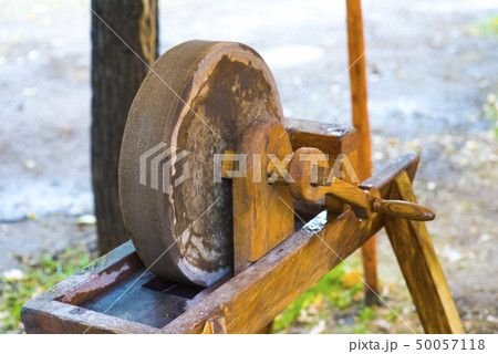 old rotary grindstone at a country house old rotary grindstone at a country house 50057118