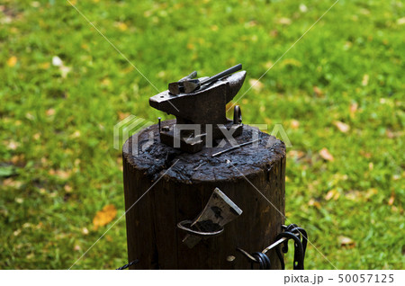 A hammer on an anvil. The tool uses a blacksmith in a blacksmith shop 50057125
