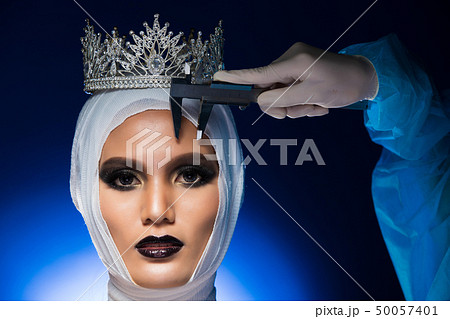Aesthetic Miss Beauty Pageant Contest Diamond Crown was checked diagnose test by Nurse Doctor hand with medical measurement equipment. Studio Lighting gradient Blue Background 50057401