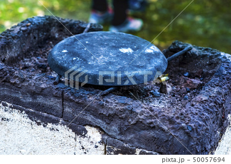 vintage stone tilesfor cooking in nature at the stake 50057694