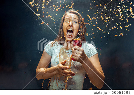 Woman drinking a cola Woman drinking a cola 50061592