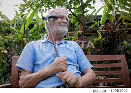 senior man sitting alone and try to remember and 50061602