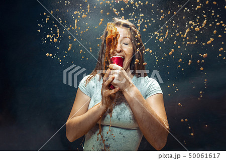 Woman drinking a cola 50061617