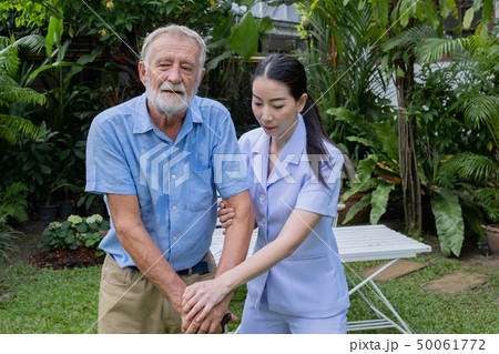 senior man happiness and smiling nurse, takes care senior man happiness and smiling nurse, takes care 50061772