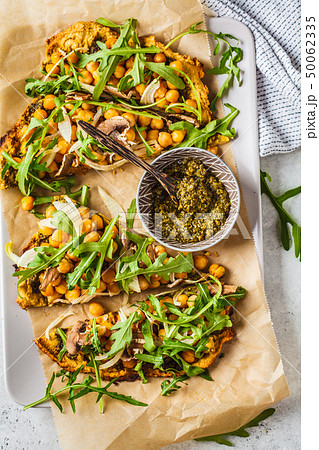 Green vegan pizza with pesto, chickpeas Green vegan pizza with pesto, chickpeas 50062335