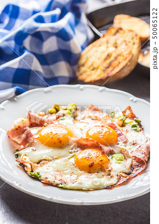 English breakfast fried bacon ham and eggson white English breakfast fried bacon ham and eggson white 50065122