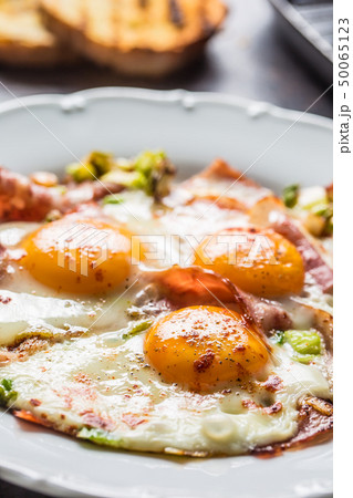 English breakfast fried bacon ham and eggson white 50065123