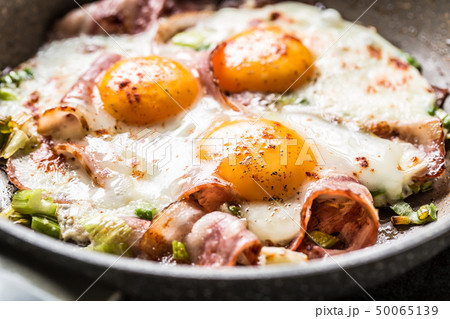 English breakfast fried bacon ham and eggs in English breakfast fried bacon ham and eggs in 50065139