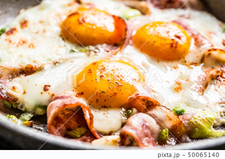 English breakfast fried bacon ham and eggs in English breakfast fried bacon ham and eggs in 50065140