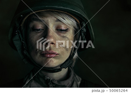 Portrait of young female soldier 50065264
