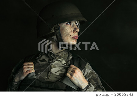 Portrait of young female soldier 50065542