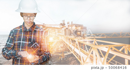 Engineer or Technician woman with safety helmet 50068416