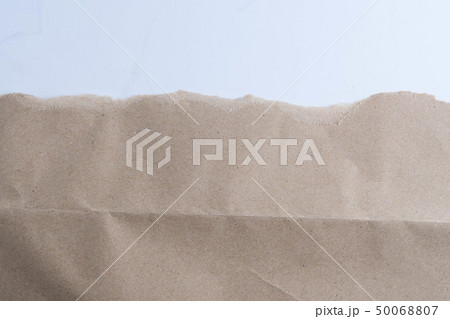 ripped in brown paper on white 50068807