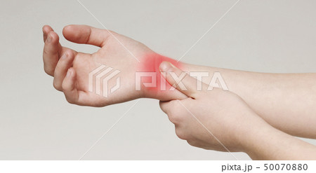 Young woman suffering from carpal tunnel syndrome Young woman suffering from carpal tunnel syndrome 50070880