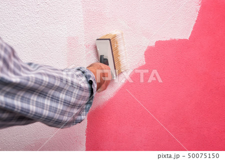 House painter worker at work in the construction House painter worker at work in the construction 50075150