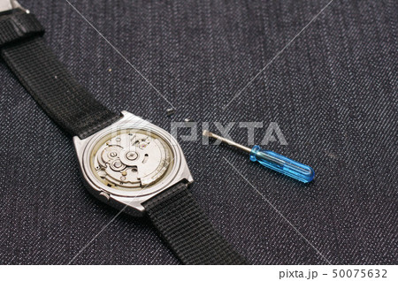 Closeup machine watch using as a background or wal 50075632