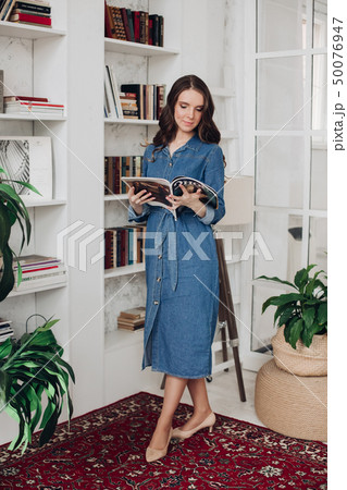 Elegant gorgeous brunette woman in denim dress and Elegant gorgeous brunette woman in denim dress and 50076947