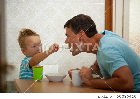 Spoon-feeding of a father 50080410