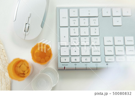 Open pill bottles by computer keyboard and mouse Open pill bottles by computer keyboard and mouse 50080832