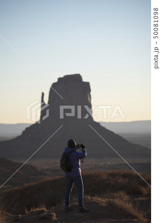 Woman photographing Monument Valley in Arizona, USA 50081098