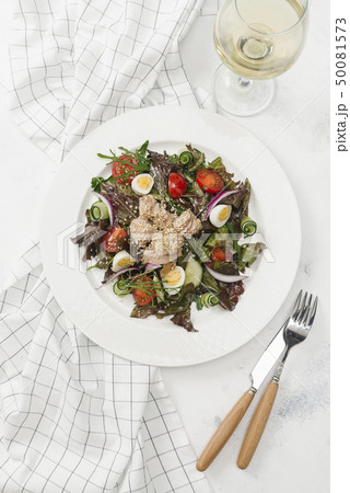Plate of salad with white wine 50081573