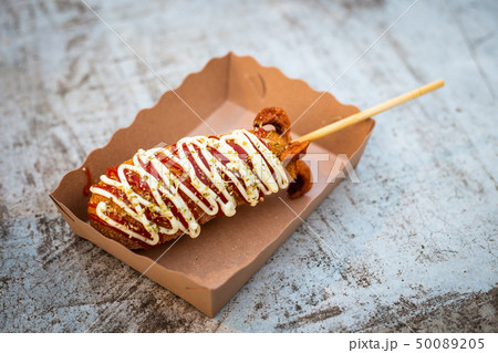 Mozzarella cheese stick sausages in paper cup  50089205