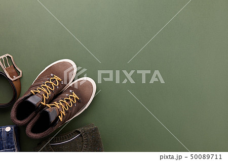 Mens fall casual clothes flat lay on green Mens fall casual clothes flat lay on green 50089711