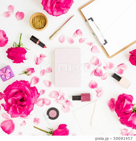 Workspace with clipboard, pastel roses, cosmetics Workspace with clipboard, pastel roses, cosmetics 50091457
