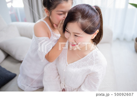 Daughter whisper to mom Daughter whisper to mom 50092607