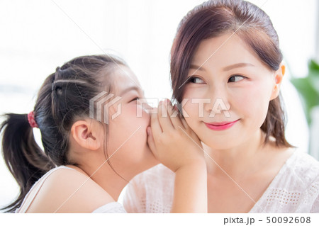 Daughter whisper to mom Daughter whisper to mom 50092608