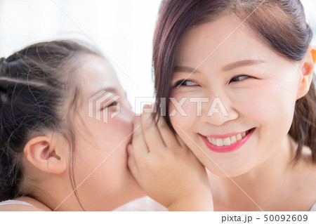 Daughter whisper to mom Daughter whisper to mom 50092609