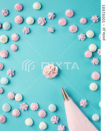 Whipped egg whites and colorful meringue cookies 50092885