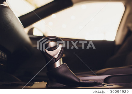 Detail of modern car interior, gear stick, automatic transmission in expensive car. Detail of modern car interior, gear stick, automatic transmission in expensive car. 50094929
