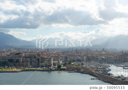 Aerial view of Palermo with mountains and clouds on background Aerial view of Palermo with mountains and clouds on background 50095533
