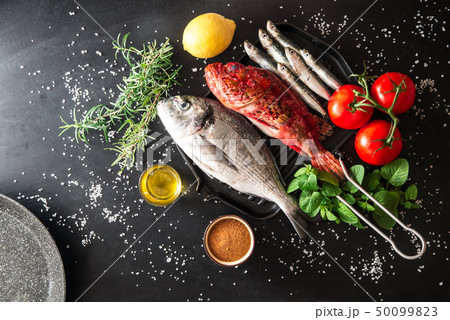preparation of a grilled fish preparation of a grilled fish 50099823