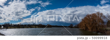 Panorama of the sky with a white cloud. 50099918
