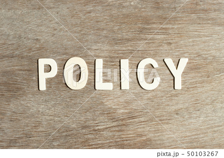 Alphabet letter in word policy on wood background Alphabet letter in word policy on wood background 50103267