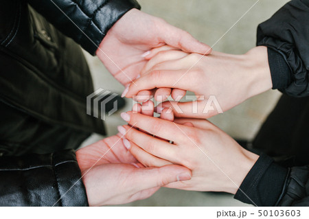 couple holding hands. look at the hands 50103603