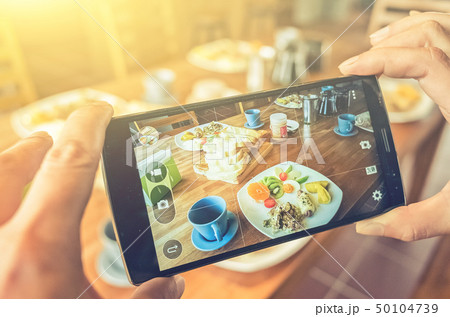 taking photo at breakfast 50104739