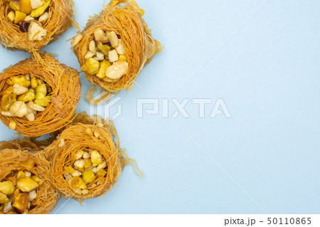 Lebanese baklava nest isolated on light blue 50110865