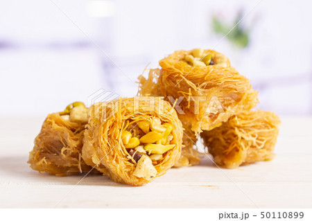 Lebanese baklava nest with kitchen behind Lebanese baklava nest with kitchen behind 50110899