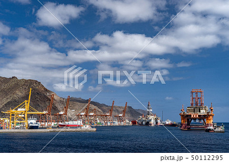 Oil rig platform at dawn in the port of Santa Cruz de Tenerife Canary Islands Spain. Anaga mountains Oil rig platform at dawn in the port of Santa Cruz de Tenerife Canary Islands Spain. Anaga mountains 50112295