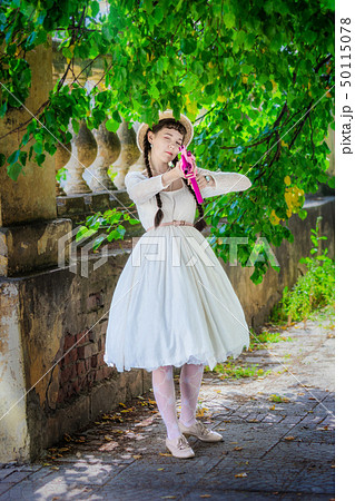 Attractive girl with pink rifle. Attractive girl with pink rifle. 50115078