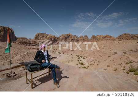 Asian man looking at landscape in Petra, Jordan Asian man looking at landscape in Petra, Jordan 50118826