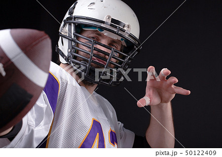 Close up portrait of American Football Player with ball 50122409