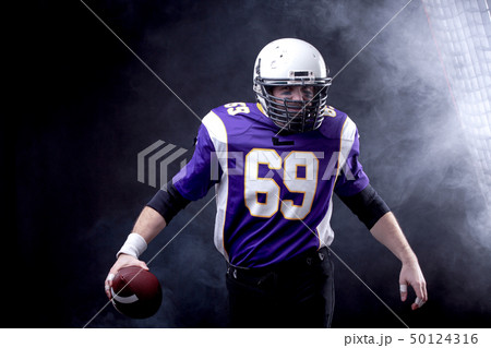 American Footballer in action 50124316