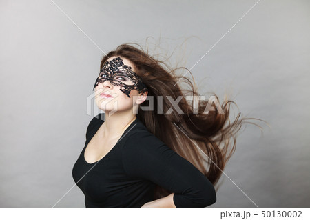 Mysterious woman wearing lace mask Mysterious woman wearing lace mask 50130002