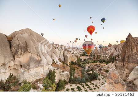 Hot air balloons flying over landscape Cappadocia 50131462